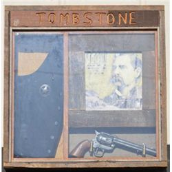 Shadowbox entitled “Tombstone” with tribute  to Wyatt Earp. Shows artfully arranged and  staged mode