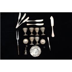 Mixed lot of sterling and plate one signed  Tiffany. 20 plus pieces. Est. $150-$300.