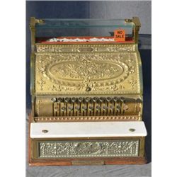 National brass cash register needing some  restoration. Est. $200-$400.