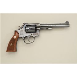 Smith & Wesson DA hand ejector revolver,  .22LR, 6” barrel, blue finish, checkered wood  medallion g