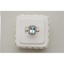 One ladies ring made in 14k white gold set  with an emerald cut aquamarine weighing  approx. 5ct and