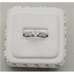 One diamond ring in 18k white gold set with   4 Princes  cut diamonds and 6rounds weighing  0.42ct. 