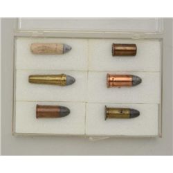 Lot of 6 antique cartridges in protective  case; all appear in very good condition.    Est.:  $40-$8