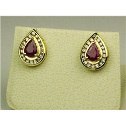 Terrific 14 karat yellow gold ladies pear  shape design earrings set with two matching  Rubies and c