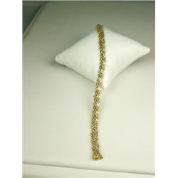 Exquisite 10 karat yellow gold ladies  designer style bracelet set with over 320  round and baguette