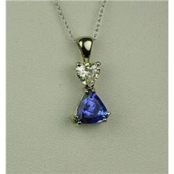 Exquisite 14 karat white gold ladies handmade  necklace set with a trilliant cut intense  purple Tan