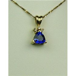 Exquisite 14 karat yellow gold ladies  necklace set with a very fine trilliant cut  Tanzanite weighi