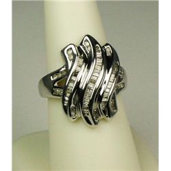 Dazzling 14 karat white gold ladies ring  channel set with round and baguette cut  diamonds weighing