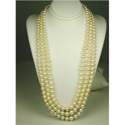 Exquisite ladies three strands of graduated  rose pink cultured pearls ranging from 4.00  MM to 7.50
