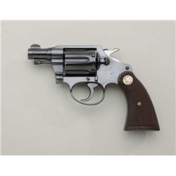 Colt Detective Special .38 Special cal., 2”  barrel, blue finish, checkered wood medallion  square b