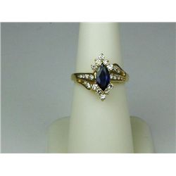 Spectacular 14 karat yellow gold ladies ring  set with a fine cobalt blue sapphire weighing  approx.