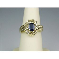 High quality 14 karat yellow gold ladies ring  bezel set with a cobalt blue sapphire  weighing appro