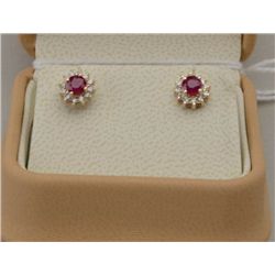 Charming 14 karat yellow gold ladies earrings  set with red rubies and diamonds with a  total weight