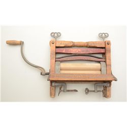 Montgomery-Ward clothes ringer from the early  20th century in overall good condition with  great ad