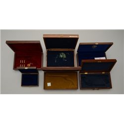 Lot of 6 wood display boxes including a Ruger  Colorado Centennial 1876-1976 factory walnut  casing 