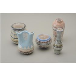 Lot of 8 pieces of Navajo pottery in  different shapes and sizes, decorated and  colored; great deco