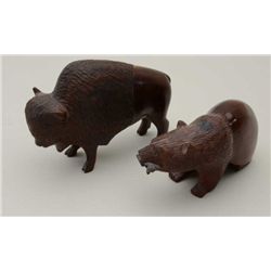 Lot of 2 carved ironwood figures, one of an  American Bison, approx. 8” long and 6” high  and a Griz