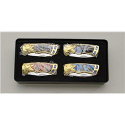 Set of 4 folding wolf theme knives in like  new condition.  Est.:  $75-$125.