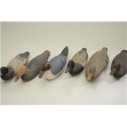 Group of 6 older carved wooden duck decoys,  all with different body styles and painting  designs an