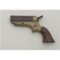 Rusty relic brass framed Sharps 4 barrel  derringer, .22 cal., left hard rubber grips  remains, righ