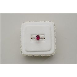 One 14k white gold ring set with a oval ruby  weighing 2.25ct and  o.30 ct of diamonds.  Est.:$1,000