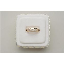 One diamond band in 14k yellow gold set with  9 round diamonds weighing approx. 0.60ct.  gold 4.4gm.