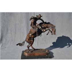 Beautiful large bronze finely detailed  re-cast of Frederic Remington’s “The Cowboy”  bronze on ston