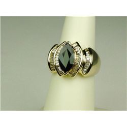 Stunning 14 karat yellow gold ladies  ballerina design ring set with a MQ cut blue  sapphire weighin