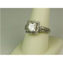 Dazzling 10 karat white gold ladies ring set  with a center PRINCESS cut diamond weighing  2.15 cara