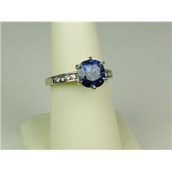 Exquisite 14 karat white gold ladies ring set  with a cobalt blue sapphire weighing 3.61  carats and