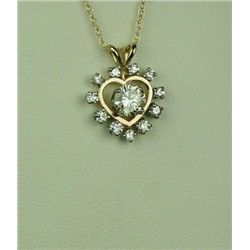 Brilliant 14 karat yellow gold ladies pendant  set with a round brilliant cut diamond  weighing 0.53