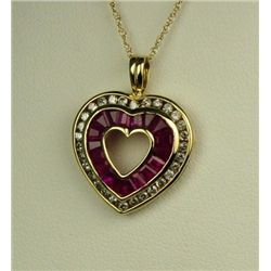 Gorgeous 10 karat yellow gold ladies heart  design pendant channel set with 48 round  diamonds and b