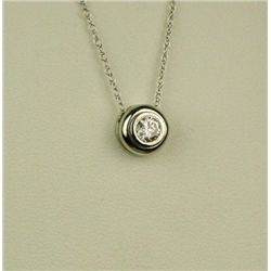 Stylish 14 karat white gold ladies pendant  bezel set with a round brilliant cut diamond  weighing a