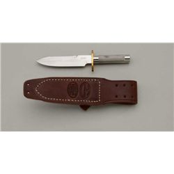 Diminutive all steel knife by Scar with brass  cross guard , leather sheath and sharpening  stone in