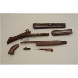 Parts lot including a brass trigger guard and  buttplate from a Tower musket on a piece of  broken s