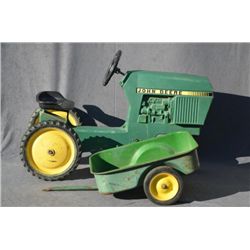 Child’s metal John Deere pedal tractor with  metal detachable two wheel carry-all in  overall good c