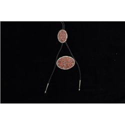 Indian coral and silver bolo tie and belt  buckle in jeweler’s container, nicely  accomplished.  Est