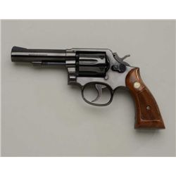 Smith & Wesson Model 10-8 DA revolver, 4”  barrel, blue finish, checkered wood medallion  grips, #4D