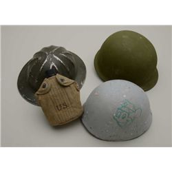 Military lot consisting of 2 helmets, 2  helmet liners, 3 canteens with covers, misc.  canvas gear a