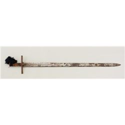 Sudanese Kaskara long sword with leather  sheath displaying decorative flaps; sword is  approx. 40” 