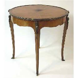 A table mahogany and walnut, Louis XVI style, h 75 cm, diameter 80,5 cm; veneer damaged 2.000-3.000.