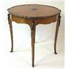 Image 1 : A table mahogany and walnut, Louis XVI style, h 75 cm, diameter 80,5 cm; veneer damaged 2.000-3.000.