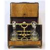 Image 1 : A tantalus 19 th century, with 3 decanters, h 28 cm; decanters not original 2.000-3.000...