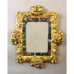 A mirror antique, 99 x 84 cm, rebronzed, later glass; damages 15.000-20.000...