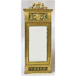 A mirror gilded and carved wood, late Gustavian, Sweden, h 104 cm, w 43 cm; renovated and completed.