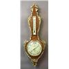 Image 1 : A barometer and thermometer veneered wood and gilded bronze, 19 th century, signed Bourgeois, Paris,