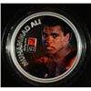 Image 2 : ALI 1 oz. painted silver round in stand with a boxing glove