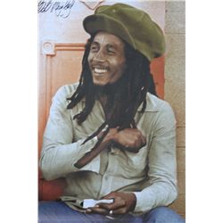 SITTING AND ROLLING A JOINT HAND SIGNED BY BOB MARLEY