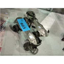 Pair of vintage chicago brand steel roller skates