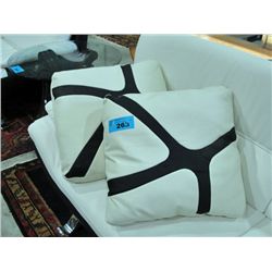 Pair of black and white leather throw cushions